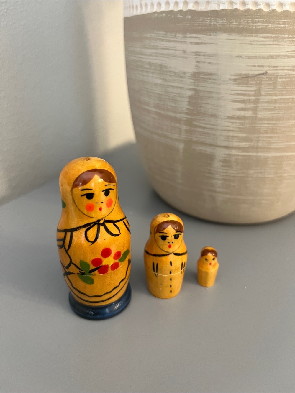 Vintage Yellow Matryoshka Doll Trio with Floral Accents
